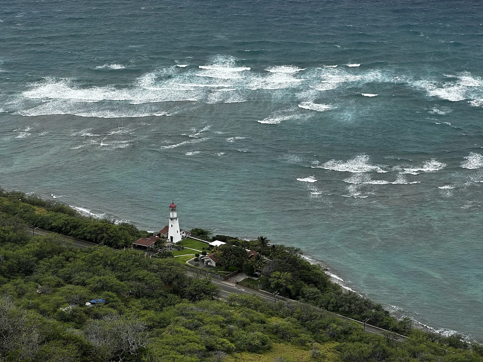 View from the Diamond Head summit trail down to the Diamond Head lighthouse and the ocean
