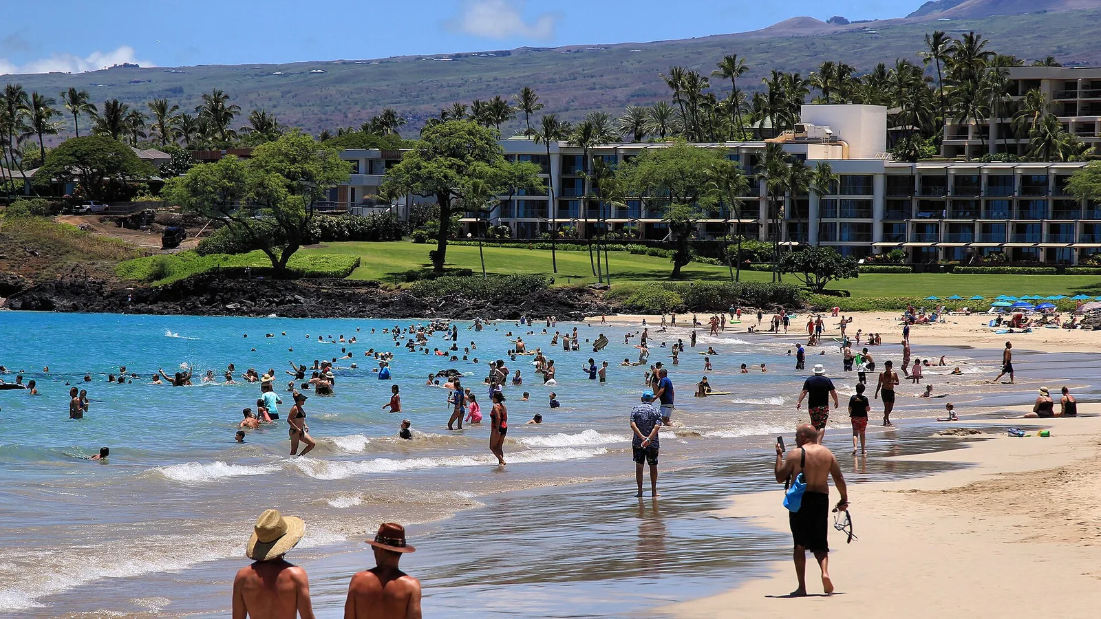 Swimmers in the clear water at Hapuna Beach on Hawaii Island
