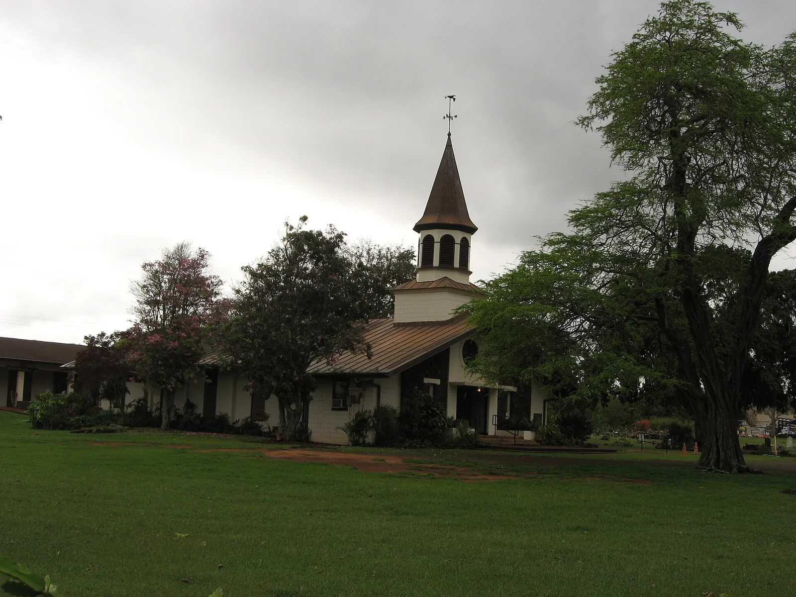The white steepled Liliuokalani Protestant Church and its lawn in Haleiwa