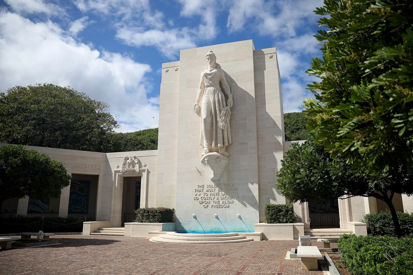 The white stone statue of Lady Columbia above the Court of Honor at the National Memorial Cemetery of the Pacific