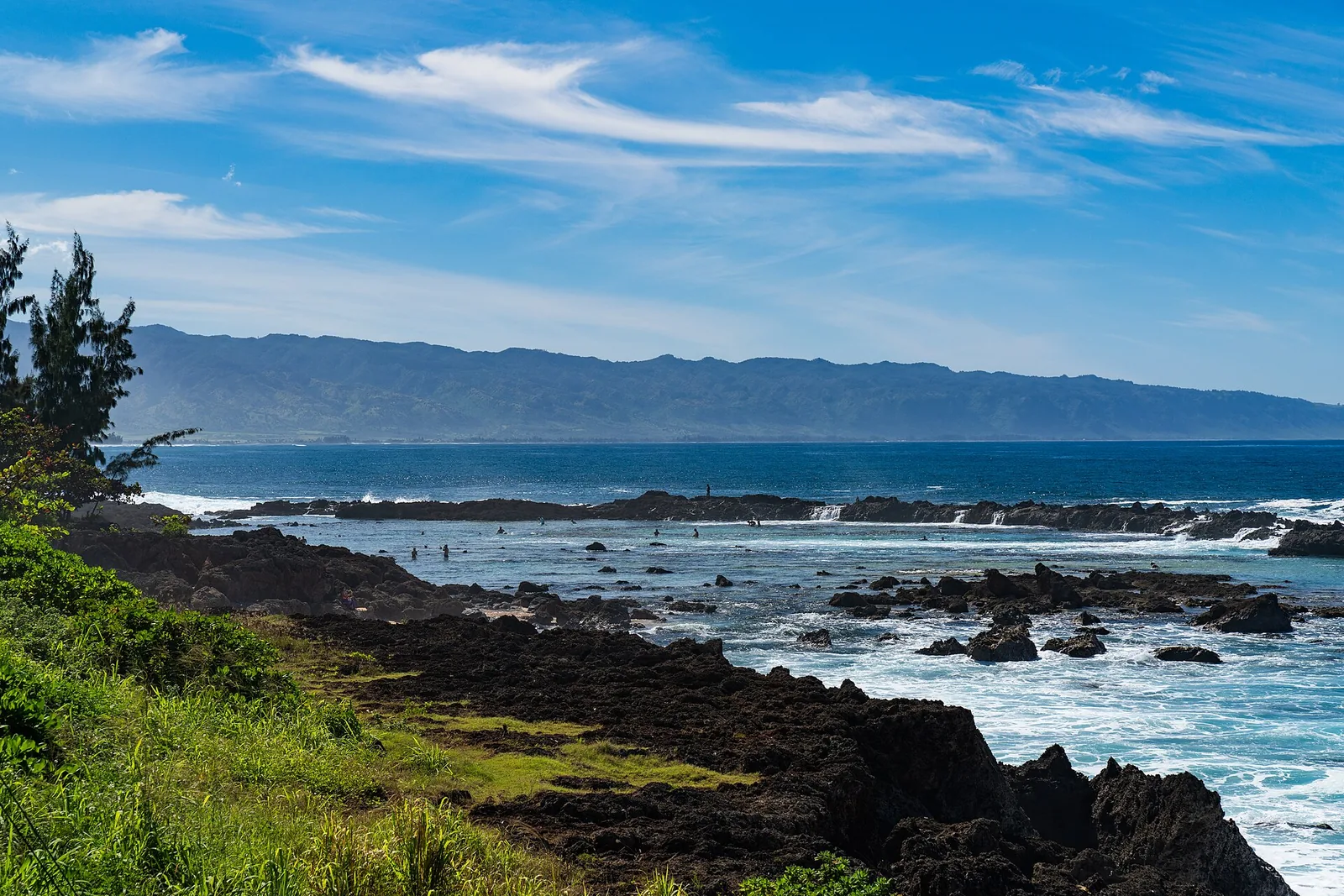 Dark lava rock shoreline and pools at Sharks Cove in Pupukea on the North Shore