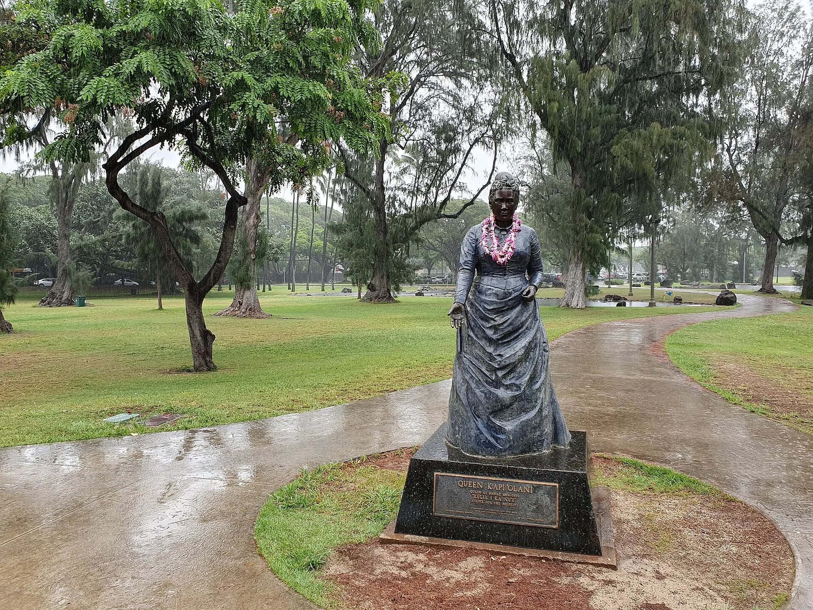 Statue of Queen Kapiolani draped in a lei in Kapiolani Park, Honolulu