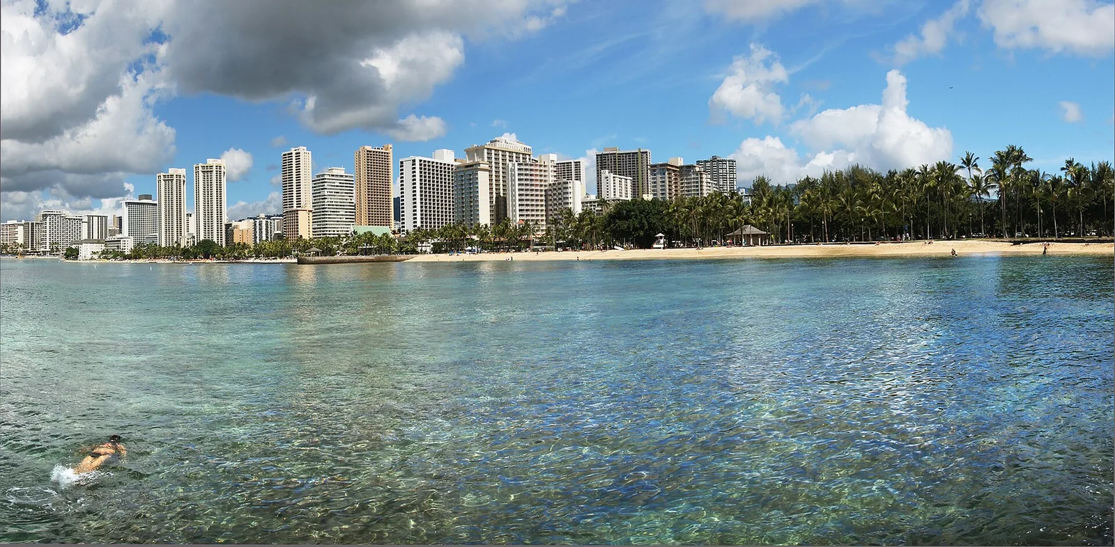 Clear shallow water off Waikiki Beach with the hotels along the shore